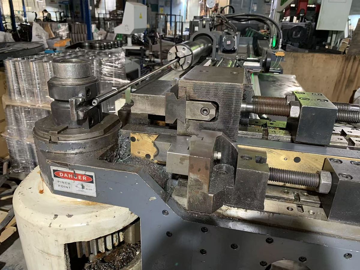 Bending die, clamp die and mandrel set up on a CNC tube bender