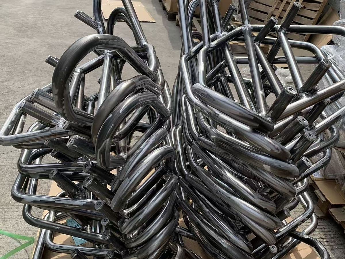 Bent tube frames stacked ready for welding