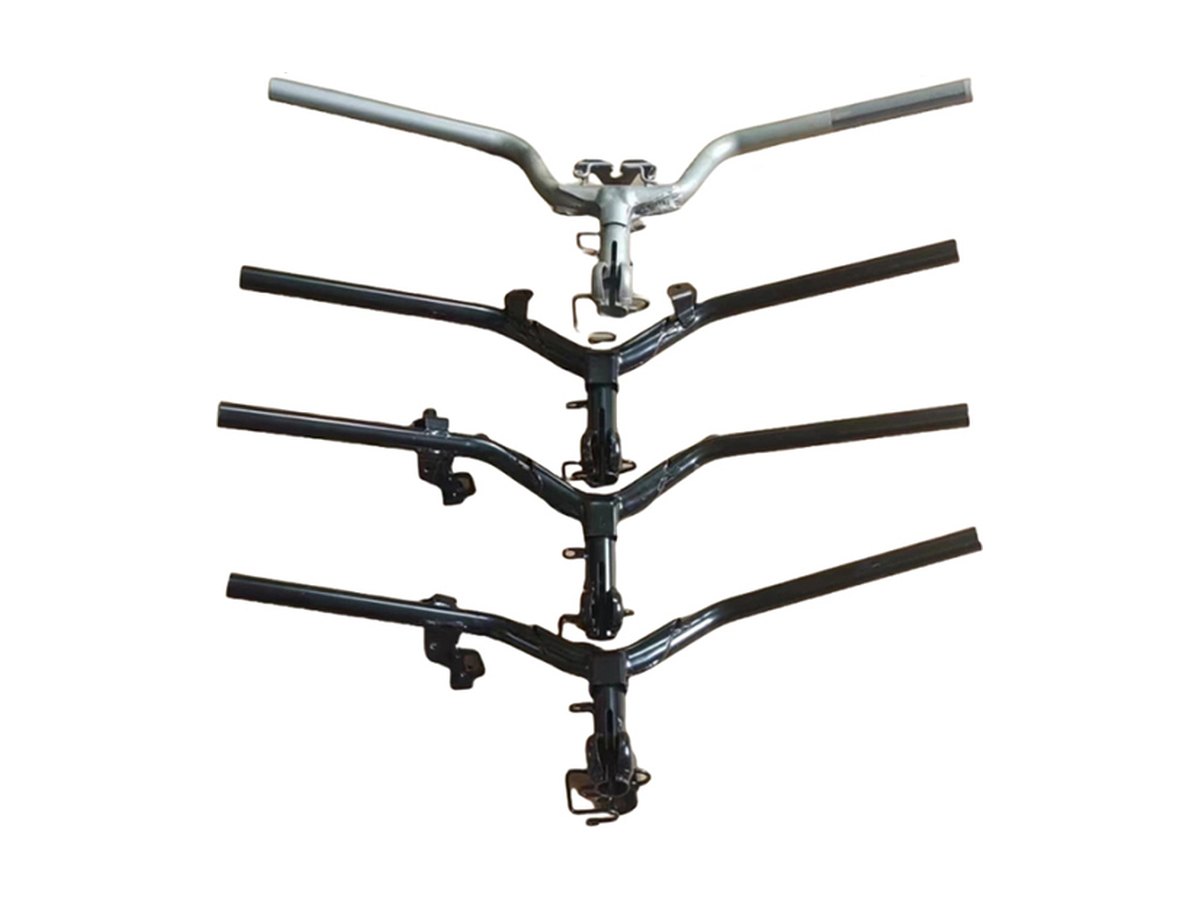 Four handlebar tube assemblies side by side, each bent symmetrically from round tube