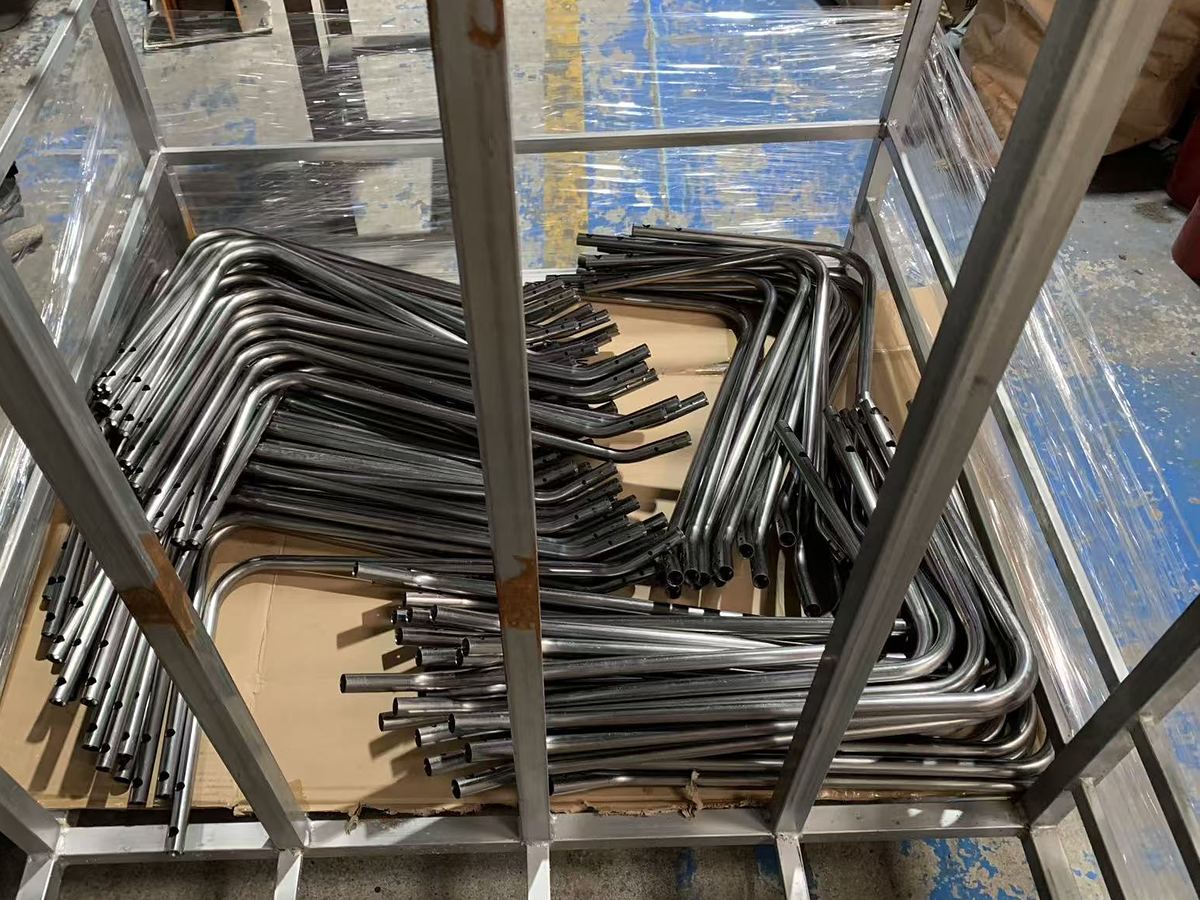 Bent tube parts loaded into a steel packaging frame