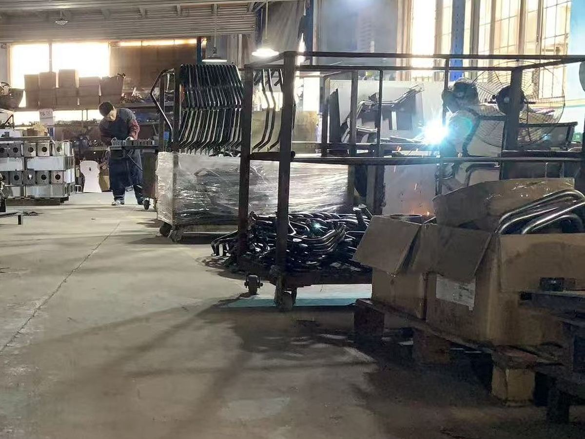 Bent tube frames stacked on racks after forming